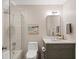 Stylish bathroom with modern vanity, decorative tile in the shower, and updated fixtures at 4435 Pemberton Cv, Johns Creek, GA 30022