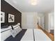 A bedroom featuring a half wall design and several entryways to other rooms at 4435 Pemberton Cv, Johns Creek, GA 30022