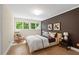 Cozy bedroom with a large window bringing the outside in and offering plenty of natural light at 4435 Pemberton Cv, Johns Creek, GA 30022