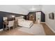 Large bedroom featuring hardwood floors, desk and chair, rug and a dark accent wall at 4435 Pemberton Cv, Johns Creek, GA 30022