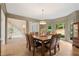 Elegant dining room featuring hardwood floors, natural light, and modern chandelier at 4435 Pemberton Cv, Johns Creek, GA 30022