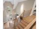 Elegant home entryway featuring wood floors, a large window, a chandelier, and staircase at 4435 Pemberton Cv, Johns Creek, GA 30022