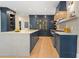 Stylish kitchen boasts a large center island, custom cabinets, and professional appliances for a refined cooking experience at 4435 Pemberton Cv, Johns Creek, GA 30022