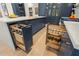 Custom cabinets with pull-out storage and spice racks in this kitchen provide convenience and organization at 4435 Pemberton Cv, Johns Creek, GA 30022
