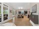 Open living space with fireplace, dining area, and views of wooded backyard at 4435 Pemberton Cv, Johns Creek, GA 30022