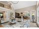 Open-concept living room with fireplace and access to the kitchen and dining area at 4435 Pemberton Cv, Johns Creek, GA 30022
