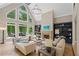 Spacious living room with large windows and fireplace, perfect for relaxation at 4435 Pemberton Cv, Johns Creek, GA 30022