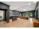 Open-concept living room with bar area and large windows offering plenty of natural light at 4435 Pemberton Cv, Johns Creek, GA 30022
