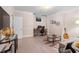 The office features white walls, a window, a desk, and decorative objects at 4435 Pemberton Cv, Johns Creek, GA 30022