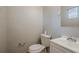 Powder room featuring a white sink vanity and toilet at 4748 Carson Sw Pass, Atlanta, GA 30331
