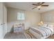 Bright bedroom with a ceiling fan, carpeted floors, ample closet space, and a playful decor at 4748 Carson Sw Pass, Atlanta, GA 30331