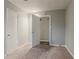 Bedroom featuring carpeting, paneling, and two closet doors at 4748 Carson Sw Pass, Atlanta, GA 30331