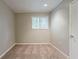 A bedroom featuring carpet, wood paneling, and a window at 4748 Carson Sw Pass, Atlanta, GA 30331
