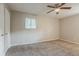 A bedroom featuring a ceiling fan, window, and neutral carpet at 4748 Carson Sw Pass, Atlanta, GA 30331