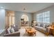 Inviting living room with neutral tones, plush seating, and an archway that leads into dining area at 4748 Carson Sw Pass, Atlanta, GA 30331