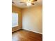 Cozy bedroom with hardwood floors, a ceiling fan, and a window at 301 Brookview Dr, Riverdale, GA 30274