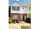 View of home showcasing the siding, brick, shutters and landscaping at 301 Brookview Dr, Riverdale, GA 30274