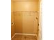 Compact laundry area featuring tile flooring, a utility hookup, and a wire rack for storage at 301 Brookview Dr, Riverdale, GA 30274