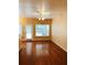 Bright living room with hardwood floors and a door to the patio at 301 Brookview Dr, Riverdale, GA 30274