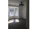 Well-lit bedroom with neutral carpet, ceiling fan, and large window with natural light at 3186 Kingswood Gln, Decatur, GA 30034