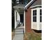Charming brick home features a bay window, grey roof, and entrance at 3186 Kingswood Gln, Decatur, GA 30034
