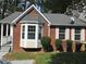 Charming brick home features a bay window, grey roof, and a cozy front porch at 3186 Kingswood Gln, Decatur, GA 30034
