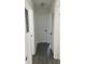 Hallway with modern flooring and white doors, leading to various rooms at 3186 Kingswood Gln, Decatur, GA 30034