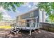 Backyard view of home featuring a wooden deck, fenced yard, and shade at 4968 Windsor Downs Ln, Decatur, GA 30035