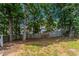Fenced backyard with mature trees and grass perfect for entertaining friends and Gathering at 4968 Windsor Downs Ln, Decatur, GA 30035