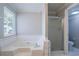 Bathroom with soaking tub and separate shower at 4968 Windsor Downs Ln, Decatur, GA 30035