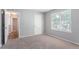 Bedroom with carpet, natural light, and a hallway entry at 4968 Windsor Downs Ln, Decatur, GA 30035