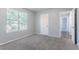 Bedroom with plush carpet and an entry to the hallway at 4968 Windsor Downs Ln, Decatur, GA 30035