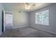 Cozy bedroom with plush carpet and a ceiling fan for added comfort at 4968 Windsor Downs Ln, Decatur, GA 30035