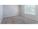 Bright bedroom with a large window for natural light at 4968 Windsor Downs Ln, Decatur, GA 30035