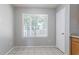 Bright kitchen nook featuring a window and tile floors at 4968 Windsor Downs Ln, Decatur, GA 30035