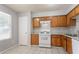 Functional kitchen with tile floors, an oven, and light wood cabinets at 4968 Windsor Downs Ln, Decatur, GA 30035