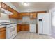 Kitchen with appliances, ample counter space, and tile floors at 4968 Windsor Downs Ln, Decatur, GA 30035