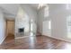 Spacious living room featuring high ceilings, wood floors, and a mirrored wall at 4968 Windsor Downs Ln, Decatur, GA 30035