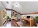 Well-appointed home office featuring hardwood floors, a built-in bookcase, and a comfortable workspace at 4968 Windsor Downs Ln, Decatur, GA 30035