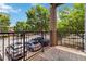 This balcony overlooks the community's parking lot with lush greenery and brick posts at 898 Oak Sw St # 3228, Atlanta, GA 30310