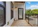 This balcony features a door to the unit, and black metal railing with green outdoor views at 898 Oak Sw St # 3228, Atlanta, GA 30310