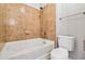 This bathroom features a shower over tub with tan tiling, a modern vanity, and white fixtures at 898 Oak Sw St # 3228, Atlanta, GA 30310