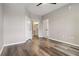 Neutral bedroom showing closet, wood floors, neutral walls, and access to bathroom at 898 Oak Sw St # 3228, Atlanta, GA 30310