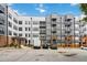 Modern building with multiple units, each featuring private balconies and convenient parking at 898 Oak Sw St # 3228, Atlanta, GA 30310