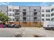 View of apartment building exterior showing parking and private balconies at 898 Oak Sw St # 3228, Atlanta, GA 30310