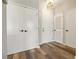 Hallway with vinyl flooring and multiple closet doors at 898 Oak Sw St # 3228, Atlanta, GA 30310