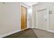 Hallway featuring unit entrance door and stairwell access at 898 Oak Sw St # 3228, Atlanta, GA 30310