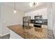 Modern kitchen featuring stainless steel appliances and granite countertops at 898 Oak Sw St # 3228, Atlanta, GA 30310