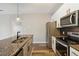 Kitchen featuring stainless steel appliances and granite countertops at 898 Oak Sw St # 3228, Atlanta, GA 30310