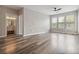 Well-lit living room features wood floors, and access to bathroom and bright windows at 898 Oak Sw St # 3228, Atlanta, GA 30310